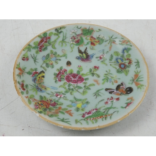 134 - An antique oriental hand painted plate decorated with birds and flowers.