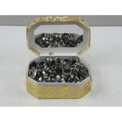 151 - A jewellery box containing a large quantity of vintage white metal dress rings.