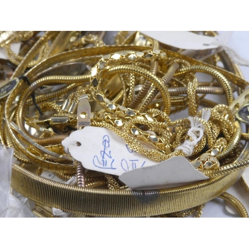 152 - A large assortment of ex shop stock gold plated chains etc