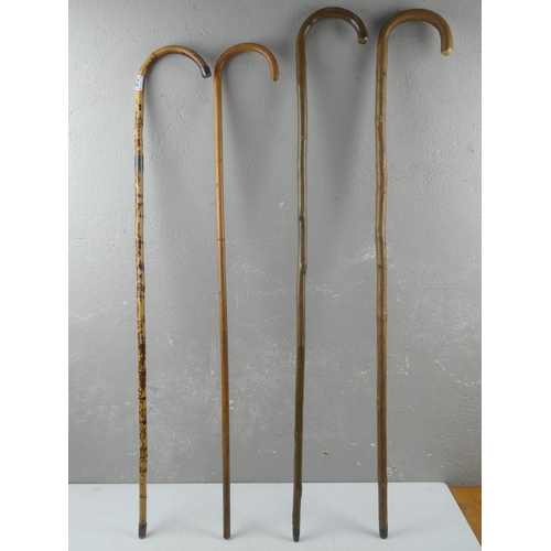 172 - Four vintage walking sticks/ canes.