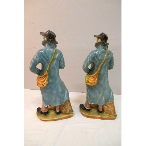 517 - A pair of antique figures depicting a man with his dog.