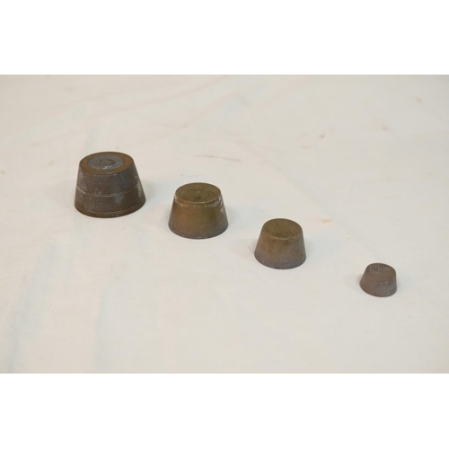 532 - A Georgian set of bronze nesting weights.