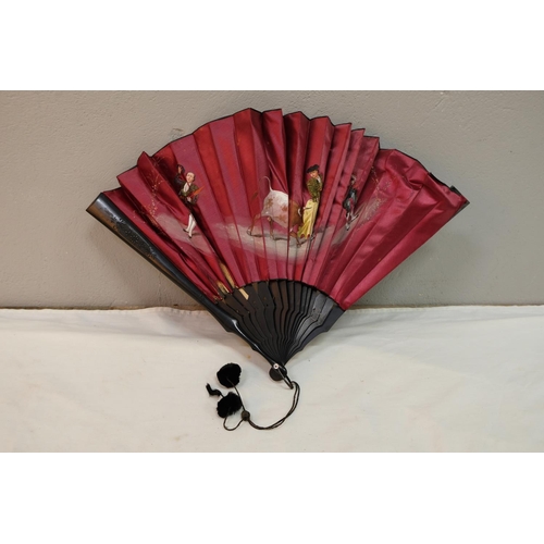 542 - A vintage hand fan with hand painted details.