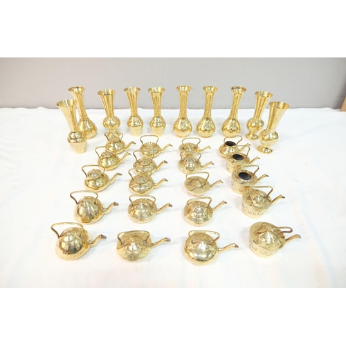 545 - A large assortment of vintage brassware.