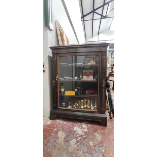 518 - A stunning antique ebony Pier display cabinet with inlaid detail.