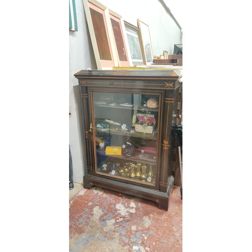 518 - A stunning antique ebony Pier display cabinet with inlaid detail.