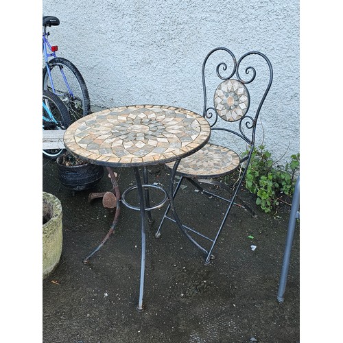 20 - A mosaic topped garden table & matching chair set.