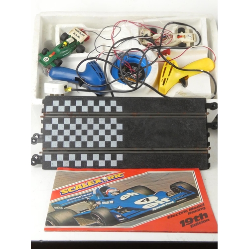 48 - A vintage boxed Scalextric 100 racing car set and additional track.