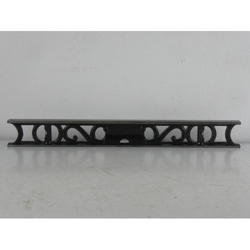 66 - An antique cast iron spirit level, measuring 46cm.