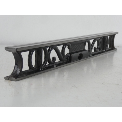 66 - An antique cast iron spirit level, measuring 46cm.