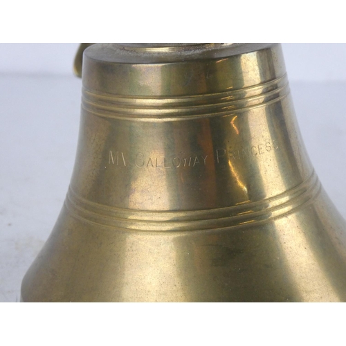 73 - A wall mounted brass bell.