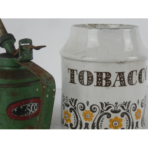 75 - A vintage ceramic Tobacco jar, a vintage Essco oil can, along with two vintage table lighters.