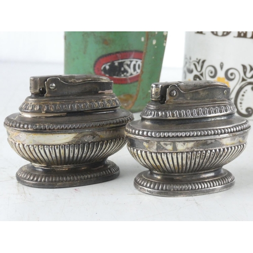 75 - A vintage ceramic Tobacco jar, a vintage Essco oil can, along with two vintage table lighters.