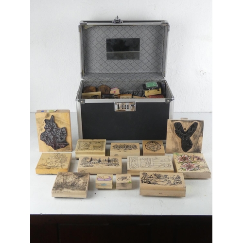 109 - A large assortment of crafting rubber stamps in carry case.