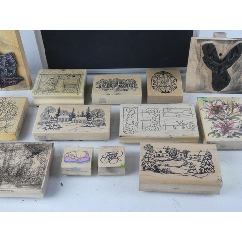 109 - A large assortment of crafting rubber stamps in carry case.