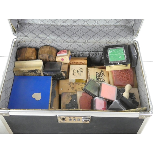 109 - A large assortment of crafting rubber stamps in carry case.