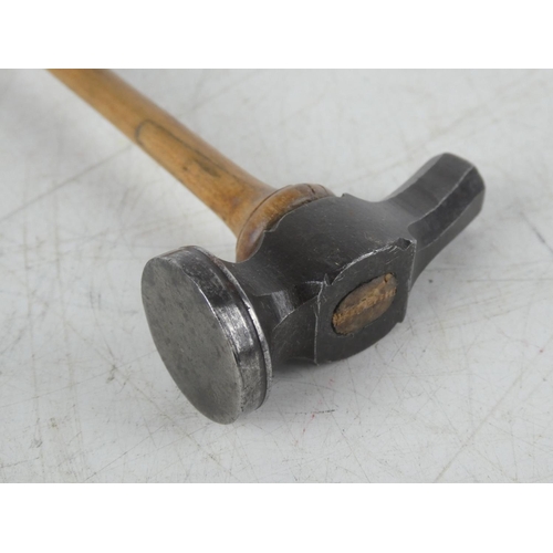 115 - An antique silversmiths/ jewellers hammer.