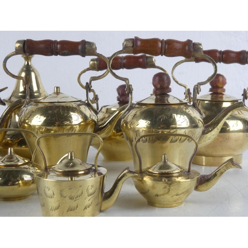 122 - A collection of various vintage brass kettles etc.