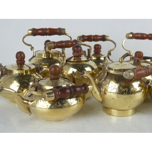 133 - A collection of various vintage brass kettles etc.