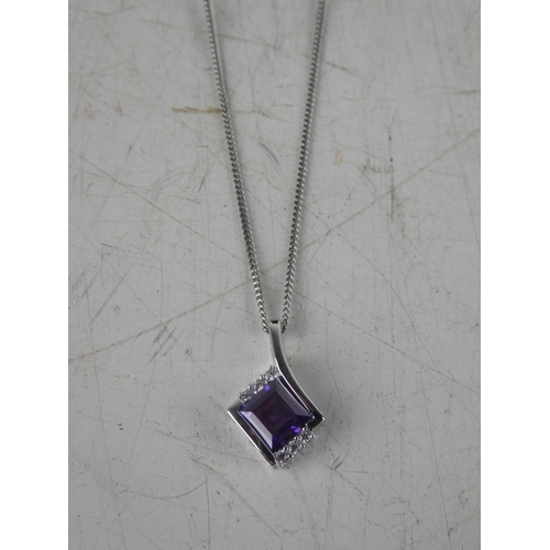 171 - A boxed pendant on chain.