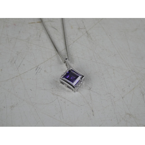 171 - A boxed pendant on chain.