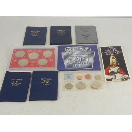 180 - A collection of 9 vintage coin sets.