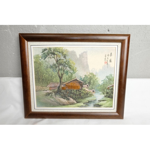 416 - A framed Oriental painting, signed, measuring 34cm x 28cm including frame.