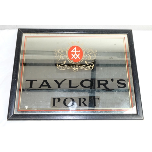 418 - A vintage pub mirror 'Taylor's Port', measuring 44cm x 34cm.