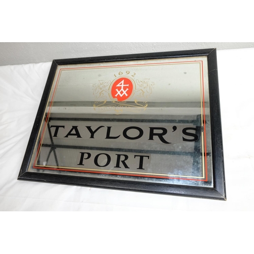 418 - A vintage pub mirror 'Taylor's Port', measuring 44cm x 34cm.