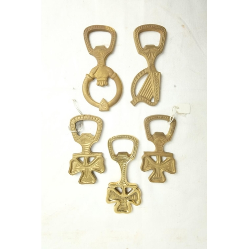 427 - Five Irish themed brass bottle openers.