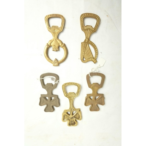 427 - Five Irish themed brass bottle openers.