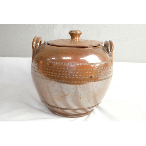 428 - A large antique two handled lidded urn.