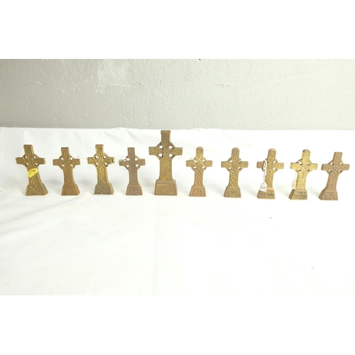 455 - A lot of small Irish brass crucifix crosses.