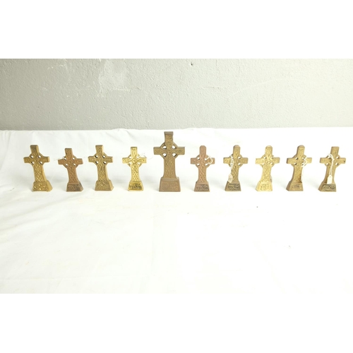 455 - A lot of small Irish brass crucifix crosses.