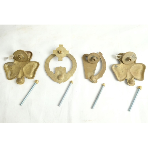 460 - Four Irish themed brass door knockers.