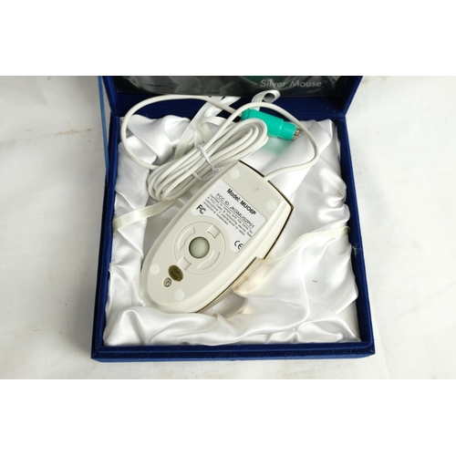 468 - A cased silver plated computer mouse, model MUO6P.