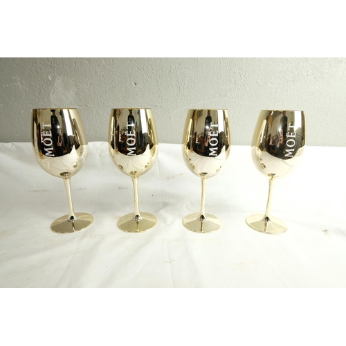 487 - Four Monet & Chandon Champagne glasses, measuring 10