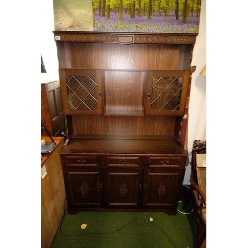 497 - A vintage Old Charm style dresser with leaded glass doors.