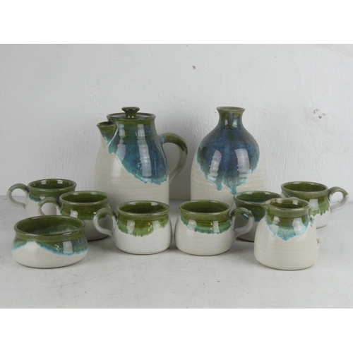 341 - A Studio pottery coffee pot, milk jug (a/f) and sugar bowl, six cups and a water pot.