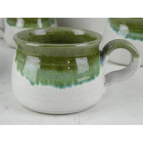 341 - A Studio pottery coffee pot, milk jug (a/f) and sugar bowl, six cups and a water pot.