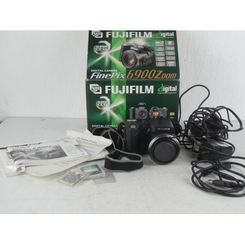 359 - A boxed Fujifilm digital camera, 6900 zoom.