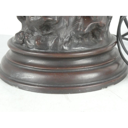 244 - A spelter table lamp with two figures.