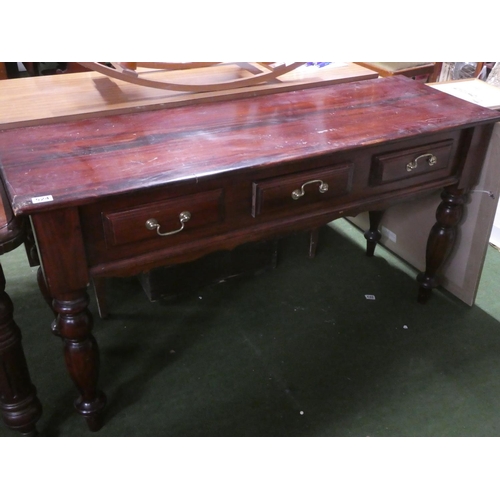 290 - A modern mahogany three drawer side table.