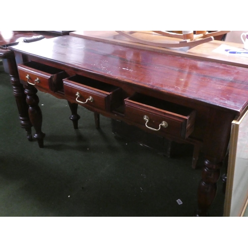 290 - A modern mahogany three drawer side table.