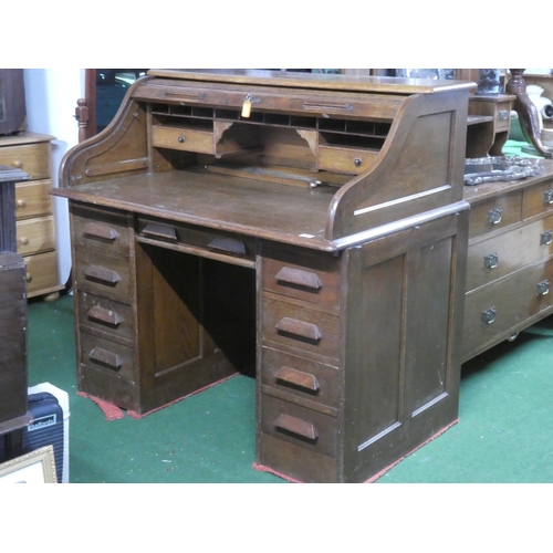 275 - A stunning antique oak roll top desk with key.