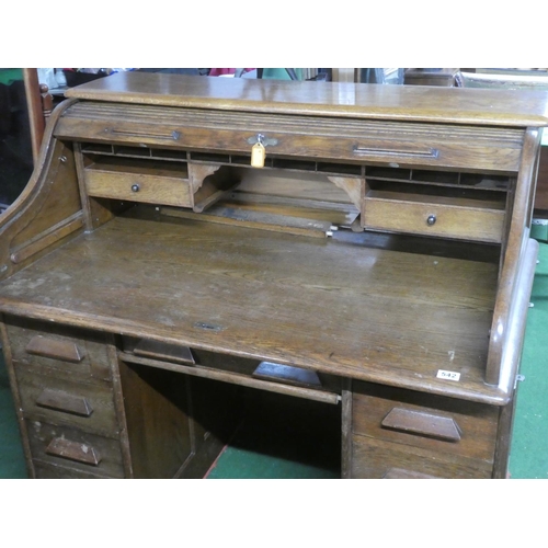 275 - A stunning antique oak roll top desk with key.