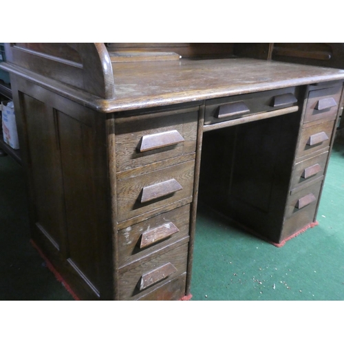 275 - A stunning antique oak roll top desk with key.