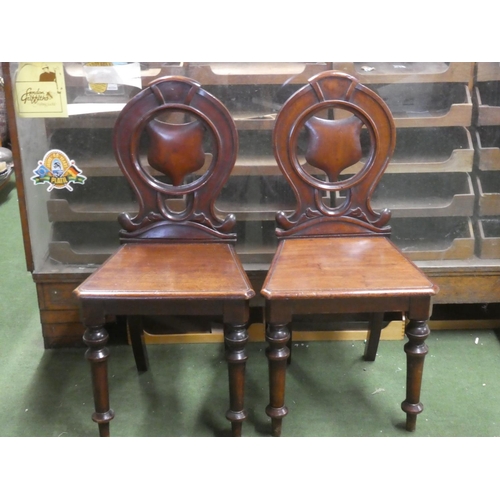 264 - A pair of antique mahogany shield back chairs.