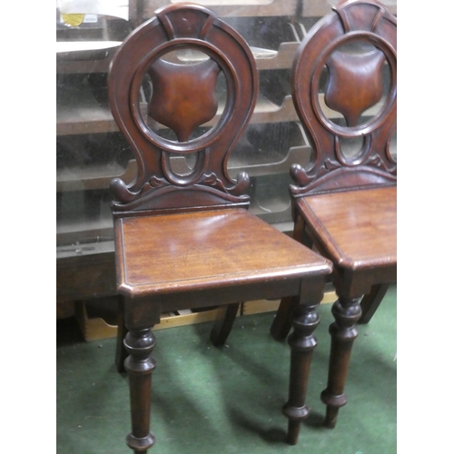 264 - A pair of antique mahogany shield back chairs.