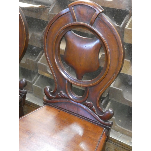 264 - A pair of antique mahogany shield back chairs.